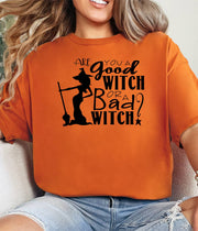 Woman wearing a burnt orange Are  You a Good Witch or a Bad Witch t-shirt.