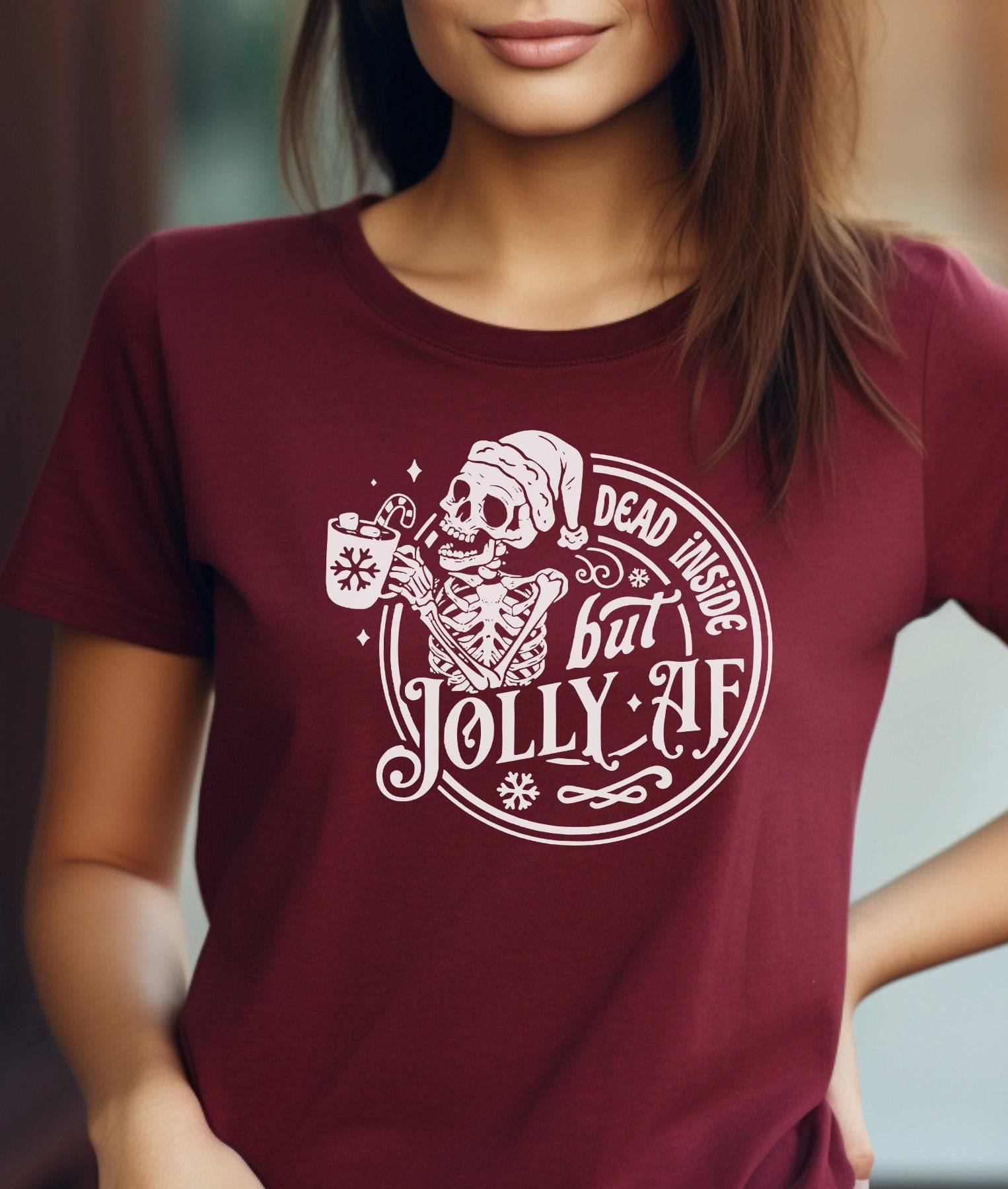 Woman wearing a maroon t-shirt that says "Dead Inside But Jolly AF."