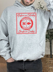 Man wearing a sport grey Huskers Chiefs hoodie sweatshirt.
