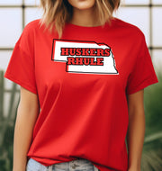 Woman wearing a red Huskers Rhule t-shirt.