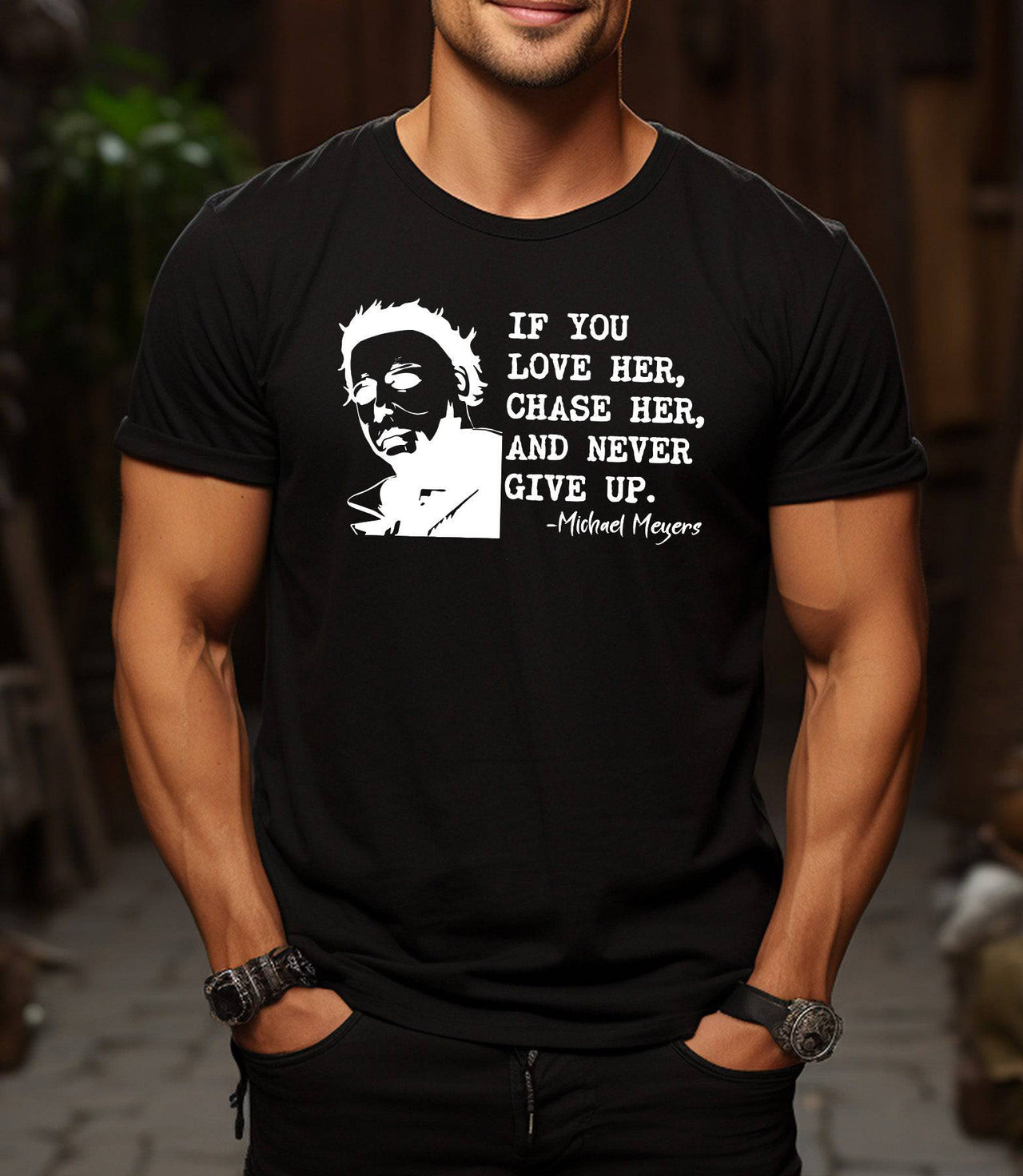 Man wearing a black t-shirt that says If You Love Her Chase Her and Never Give Up