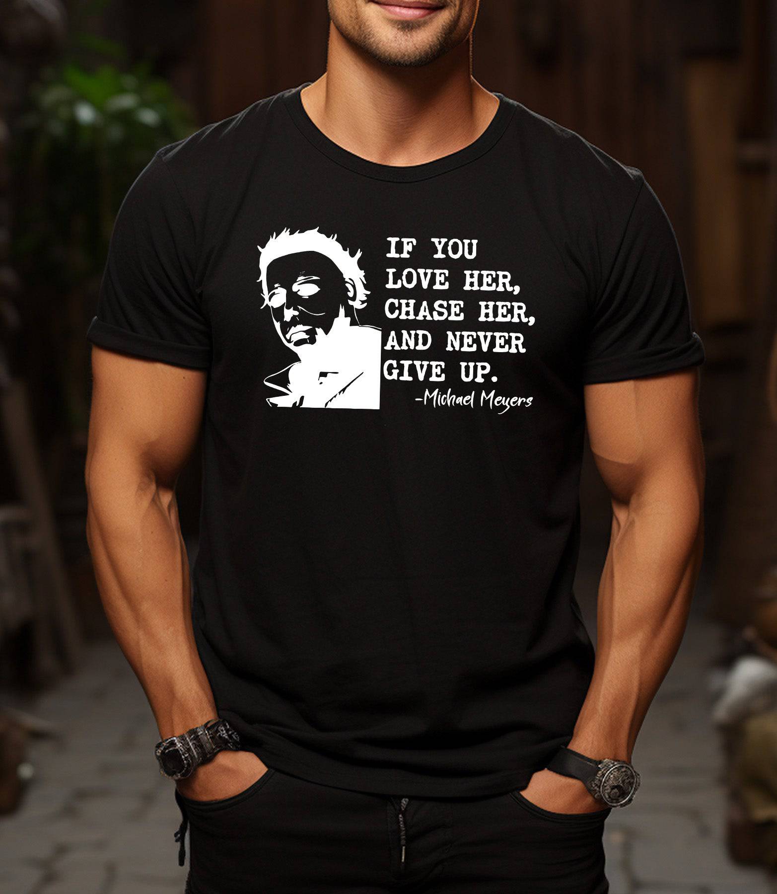 Man wearing a black t-shirt that says If You Love Her Chase Her and Never Give Up