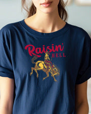 Woman wearing a navy Raisin Hell Gildan t-shirt.