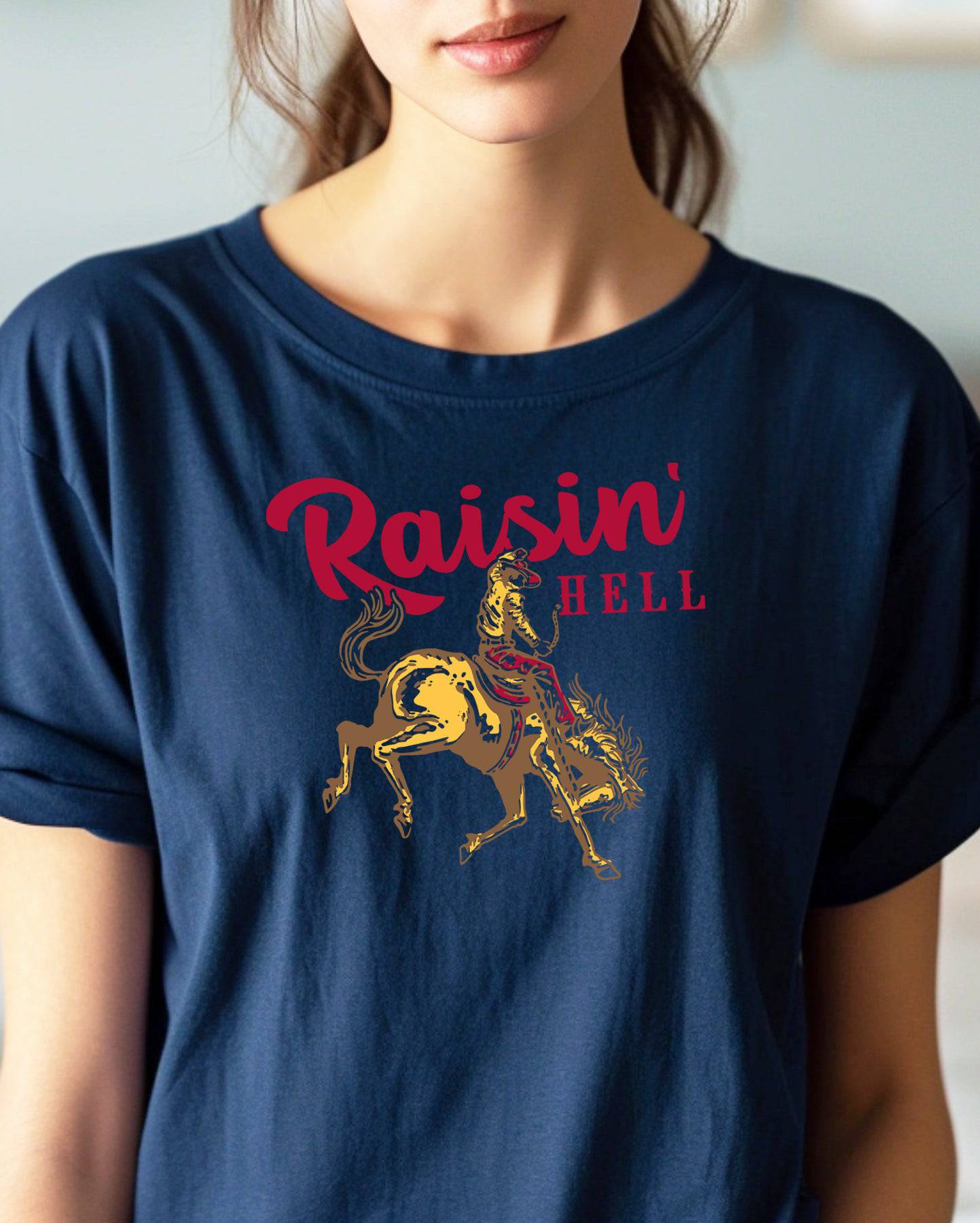 Woman wearing a navy Raisin Hell Gildan t-shirt.