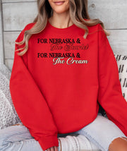 Woman wearing a red Scarlet and Cream crewneck sweatshirt.