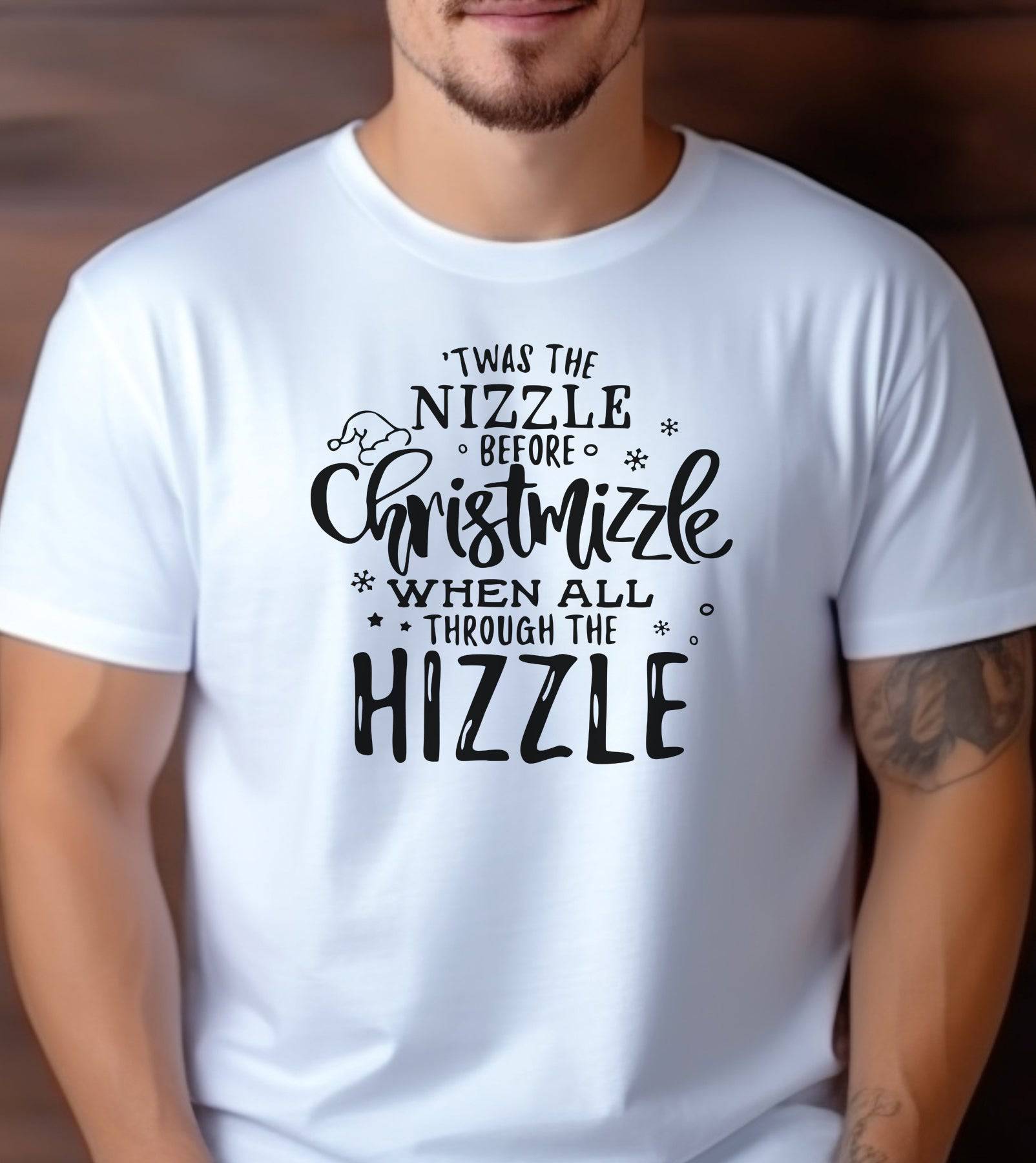 A man wearing a white t-shirt that says "Twas the Nizzle Before Christmizzle."