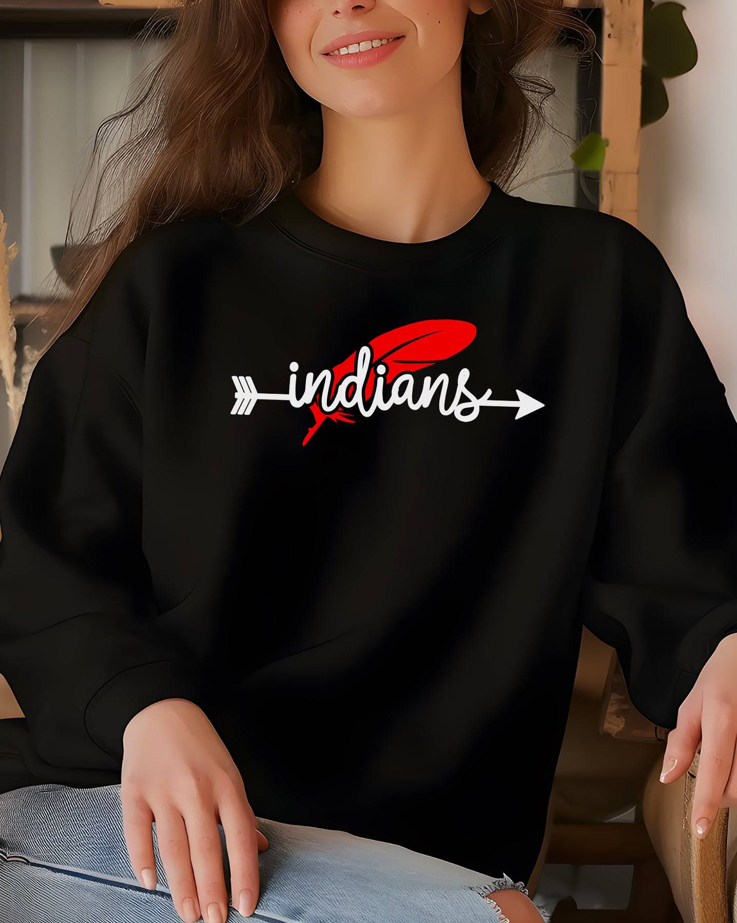 Woman wearing a black Weeping Water Indians Feather crewneck sweatshirt.
