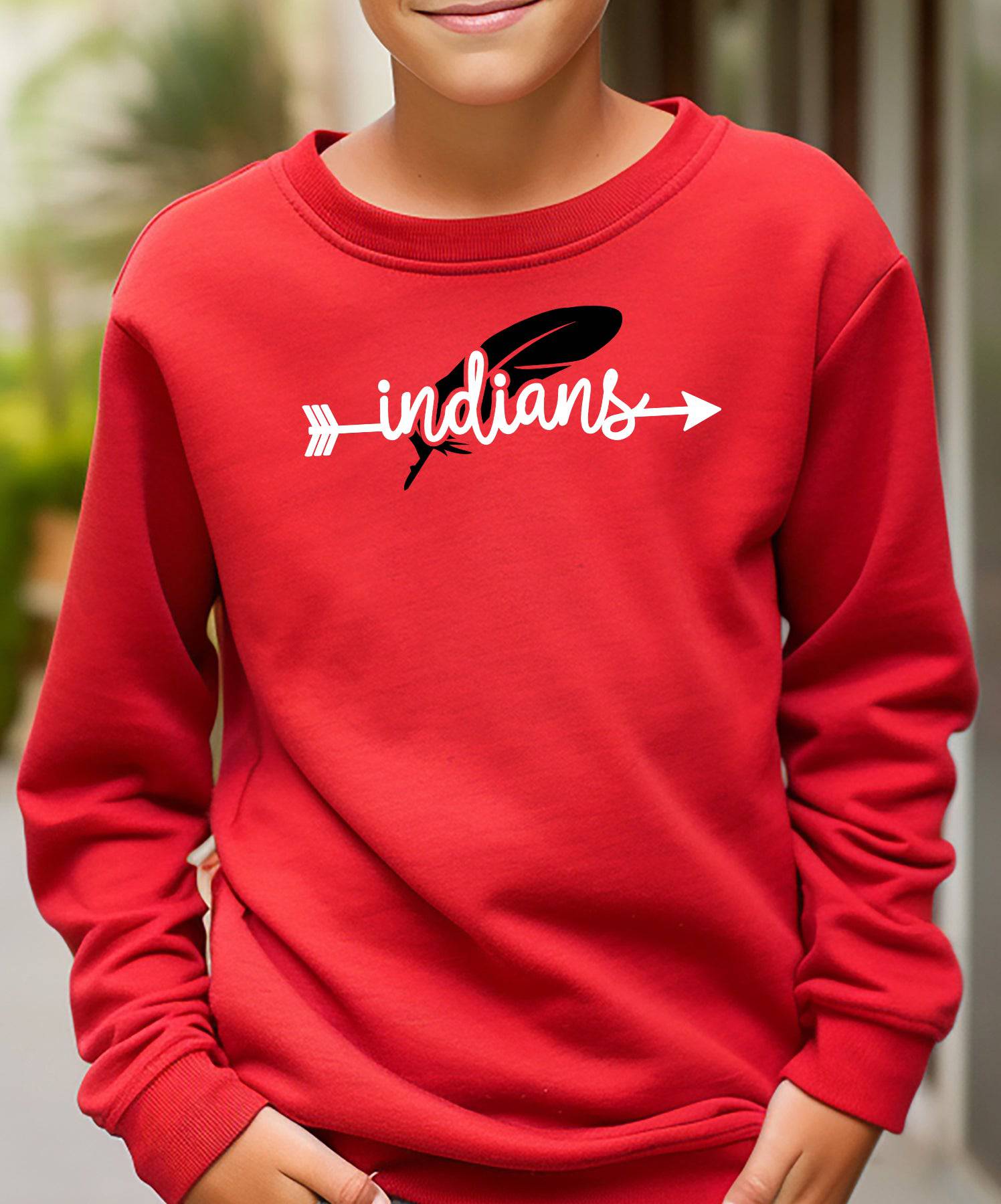 Child wearing a red Weeping Water Indians Feather crewneck.