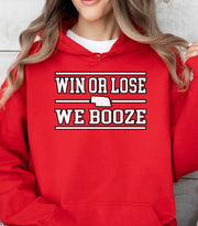 Red hoodie with 'Win or Lose, We Booze' text worn by a person