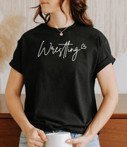 Woman wearing a black Wrestling Love t-shirt.