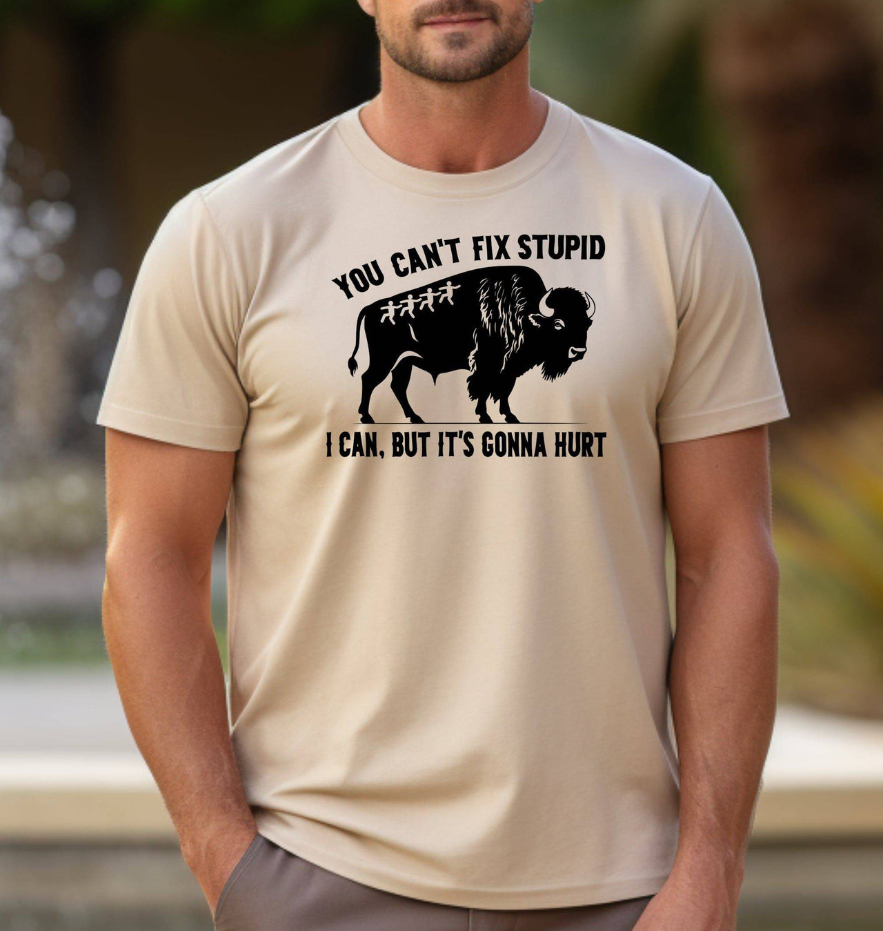 Man wearing a sand t-shirt that says You Can't Fix Stupid. I Can, But it's Gonna Hurt